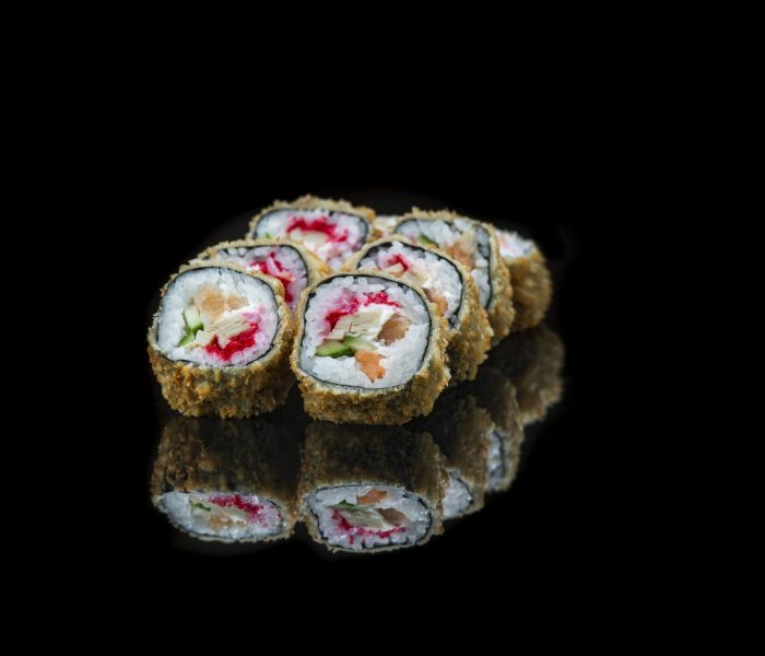 fried sushi rolls isolated on black. High quality photo